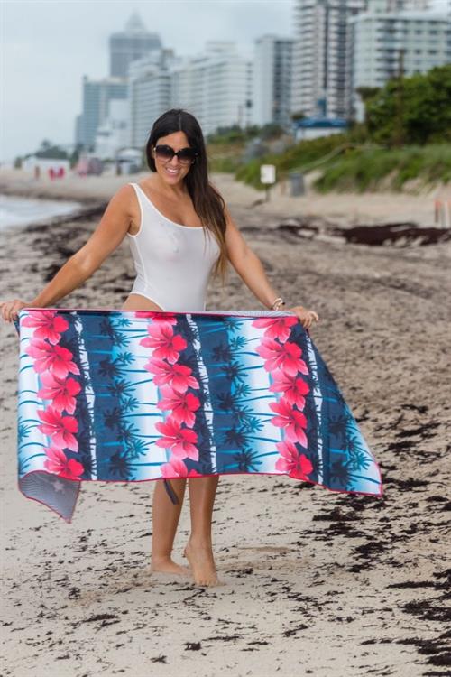 Claudia Romani Pictures Claudia Romani boobs and ass in a see through white thong swimsuit showing her tits at the beach.