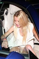 Tara Reid upskirt wardrobe malfunction flashing her panties getting in the car seen by paparazzi.

















