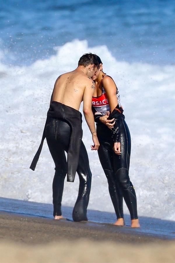 Dua Lipa sexy ass and cleavage in a swimsuit at the beach seen with her boyfriend by paparazzi.














