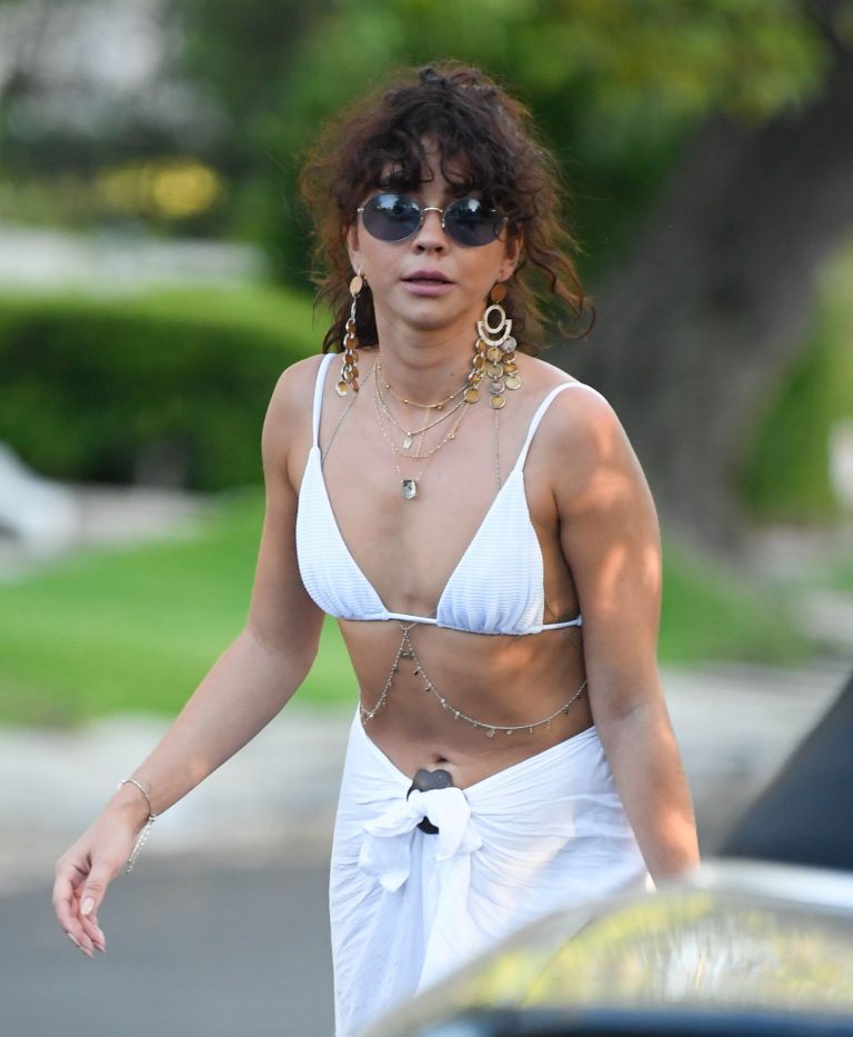 Sarah Hyland Pictures Sarah Hyland sexy in a bikini top leaving a pool party seen by paparazzi.