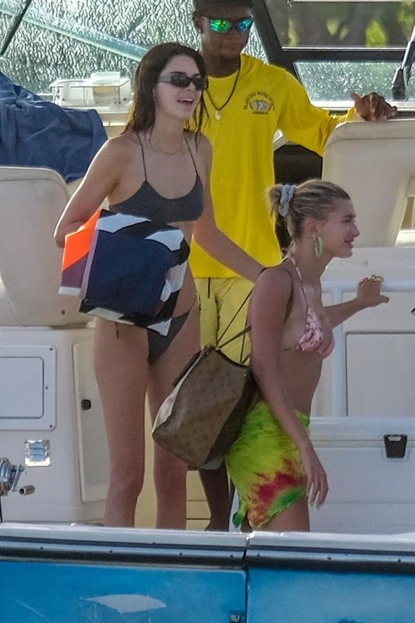 Hailey Bieber, Kendall Jenner and Justine Skye sexy bikini and swimsuit photos seen on a boat drinking for Hailey Bieber's bachelorette party.
