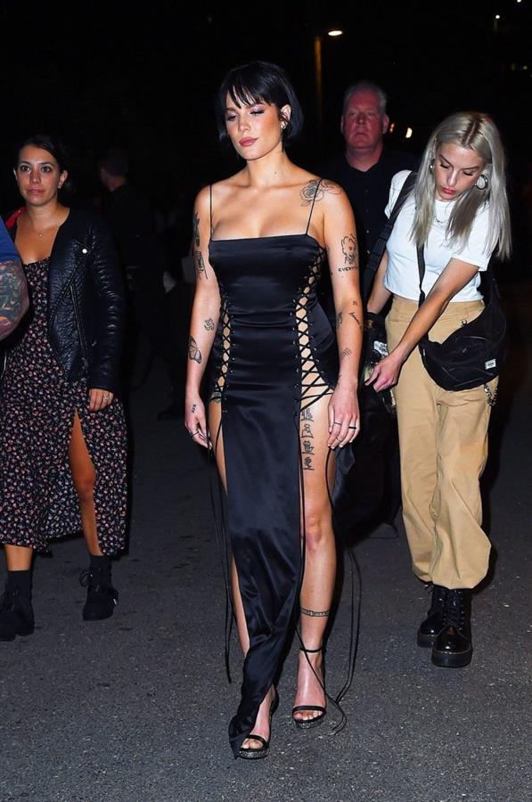 Halsey sexy in a very revealing laced dress seen by paparazzi arriving to DKNY fashion show in New York.






















