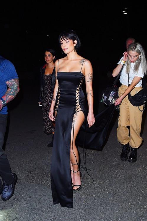 Halsey sexy in a very revealing laced dress seen by paparazzi arriving to DKNY fashion show in New York.























