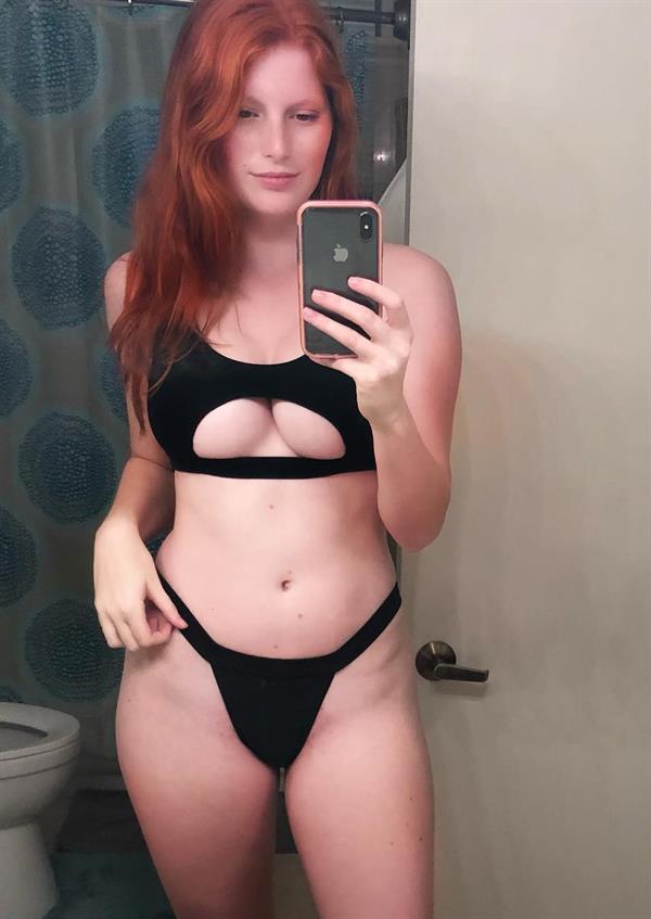 Alea Kay in a bikini taking a selfie