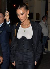Bella Hadid braless boobs in a see through top showing off her tits seen by paparazzi.







