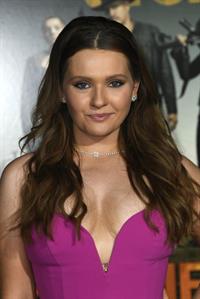 Abigail Breslin braless boobs showing nice cleavage in a low cut pink dress seen by paparazzi at the premiere of  Zombieland Double Tap .


