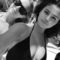 Selena Gomez in a bikini taking a selfie