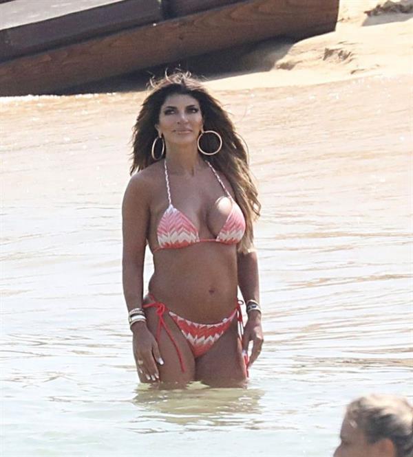 Teresa Giudice sexy ass in bikini at the beach with her big boobs showing nice cleavage seen by paparazzi at the beach.


















































