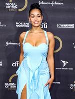 Jorja Smith big boobs showing nice cleavage in a sexy blue dress photographed on the red carpet.