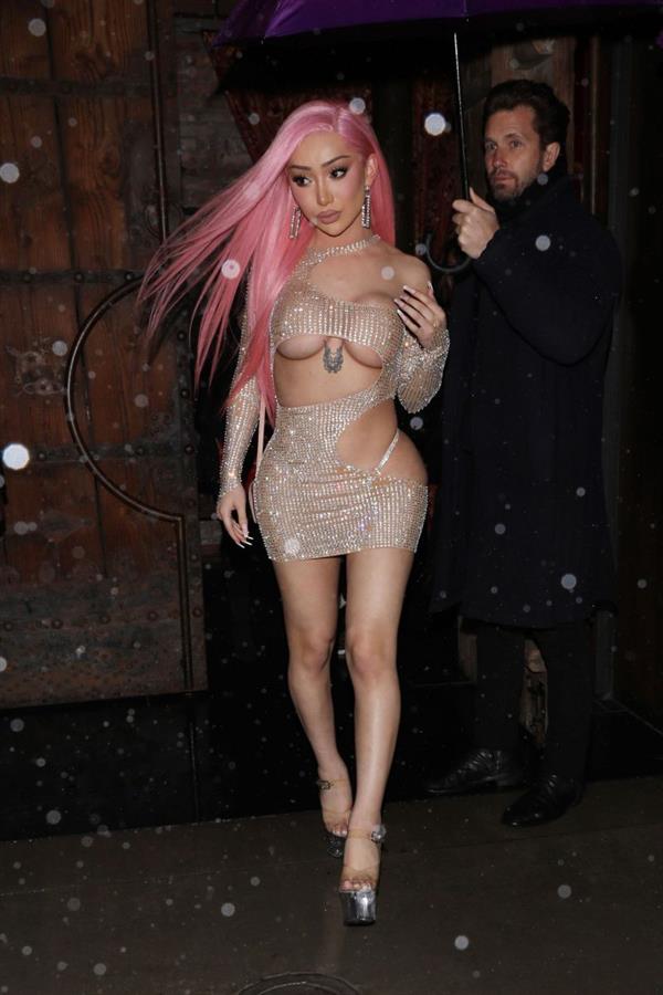 Nikita Dragun braless boobs in a see through dress showing off her big tits and her ass in a thong seen by paparazzi.