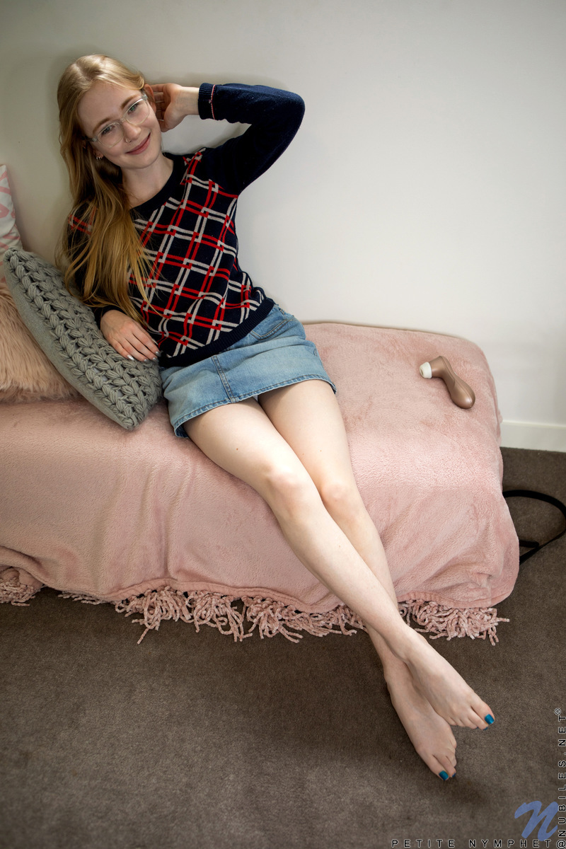 Just as her name implies, Petite Nymphet is quite the sex crazed cutie! This hottie peels off everything besides her glasses and then grabs a dildo to make her redhaired pussy pulse. Shoving the toy deep, she gives herself a natural orgasm that leaves her whole slim body shaking with delight!