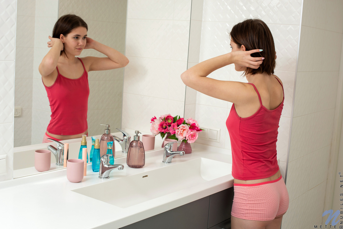 Mette always takes the time to get herself off as part of her daily routine. Today she's in the bathroom when the urge to masturbate strikes. Peeling off her clothes, she lets her hands play with her titties and her tender clit as she works herself towards a big O.