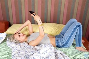 Jenny Wilson is waiting for your booty call. This Russian teen is locked and loaded for a good time, so if you can't make it to give her what she wants she'll go ahead and get naked so she can snap some naughty selfies and then masturbate her cum hungry shaved twat.