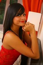  Fabulous Bebe in red lingerie with matching shoes and black stockings. 