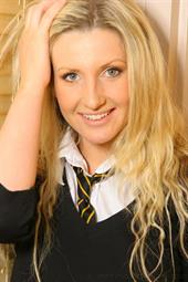  The lovely Alexandra W slipping out of her college uniform to reveal black satin bra
