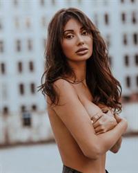 Francesca Farago topless boobs new photos holding her nude big tits wearing just cutoff shorts in an outdoor photoshoot.