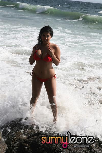 Sunny Leone wearing a red bikini