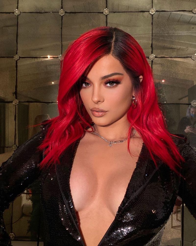 Bebe Rexha Pictures Bebe Rexha braless boobs showing nice cleavage with her tits in a sexy low cut black outfit.