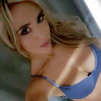 Daniela Sanchez in a bikini taking a selfie