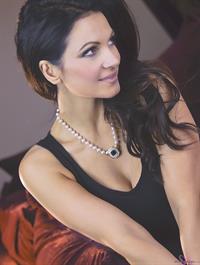 Denise Milani Photoset - Red Sofa