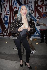 Whitney Cummings boobs showing nice cleavage as she flashes her big tits to the paparazzi with a small nip slip.
