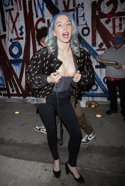 Whitney Cummings boobs showing nice cleavage as she flashes her big tits to the paparazzi with a small nip slip.