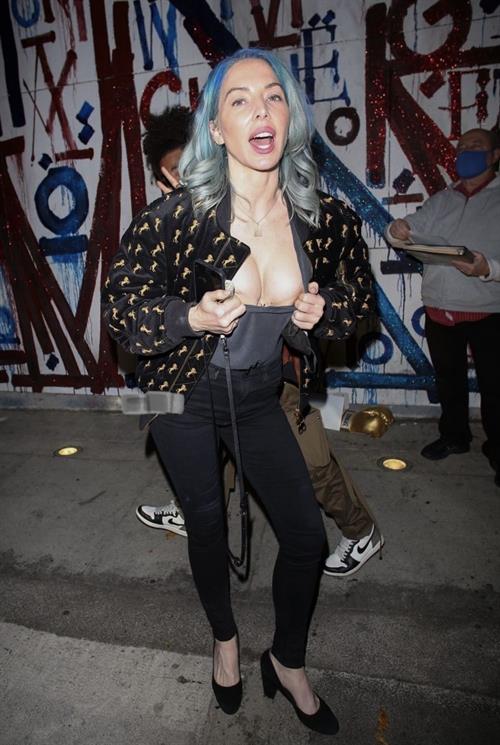 Whitney Cummings boobs showing nice cleavage as she flashes her big tits to the paparazzi with a small nip slip.