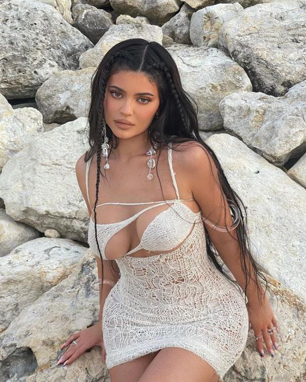 Kylie Jenner braless boobs in a sexy see through outfit showing off her big tits and nice cleavage.