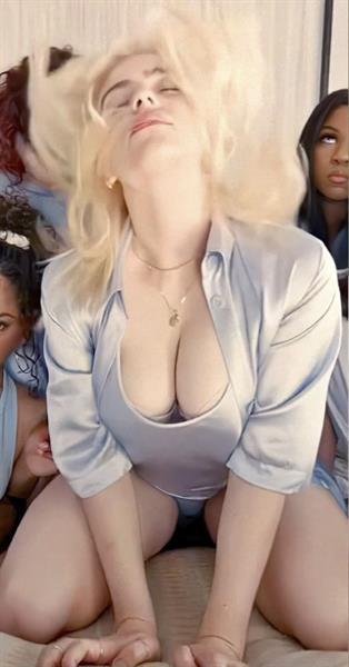 Billie Eilish boobs showing nice cleavage with her famous big tits on display in her new music video “Lost Cause”.
