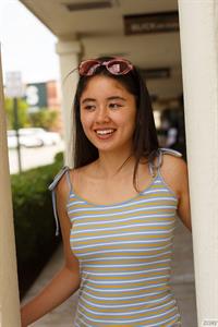 Lolita Minh Strips in her Room