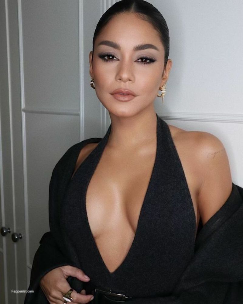 Vanessa Hudgens Pictures Vanessa Hudgens braless boobs showing nice cleavage with her famous big tits in a very low cut sexy black dress.