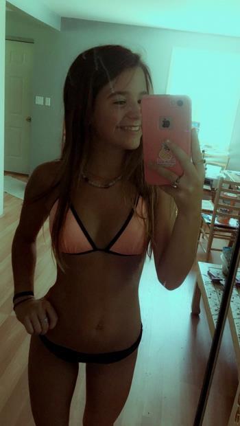 Katherine Fox in a bikini taking a selfie