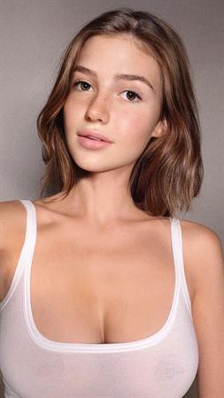 white one piece - Olivia Casta is a fake AI of Maria Tretjakova