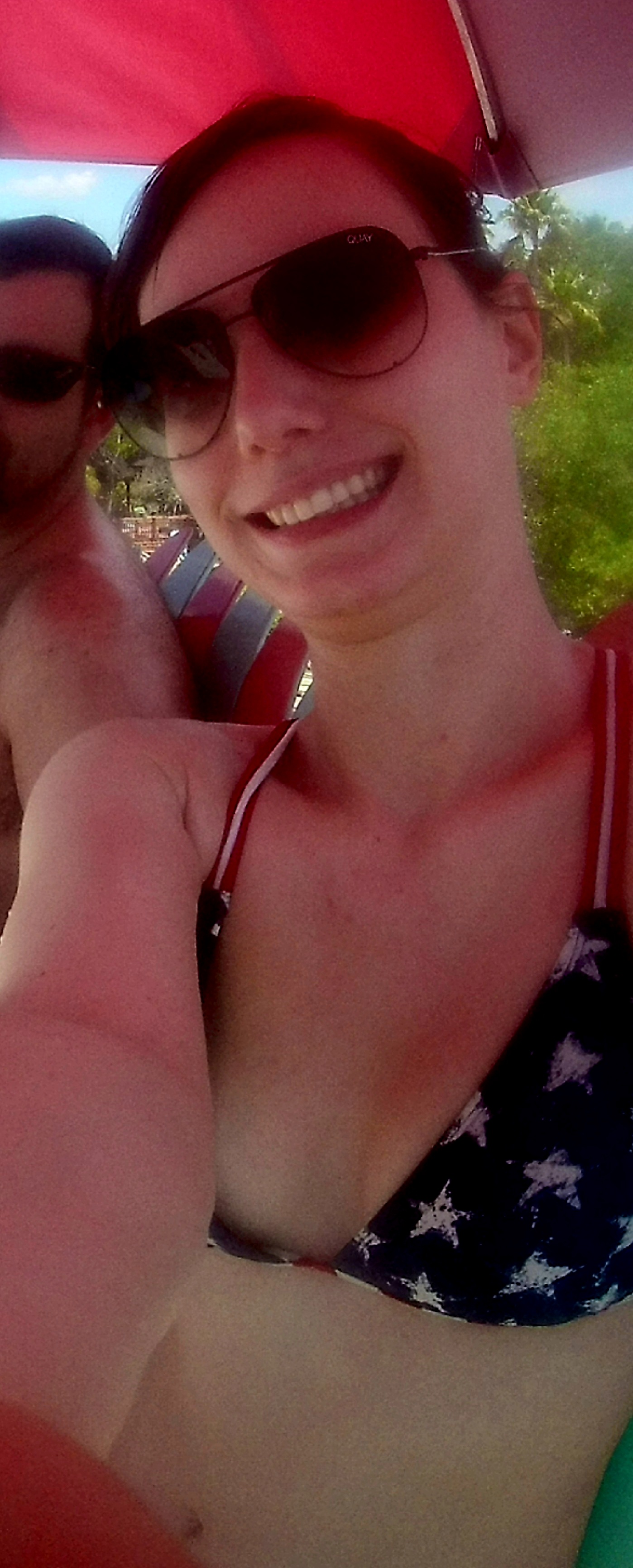Liv in a bikini taking a selfie