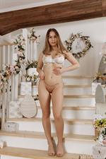 Busty Amalia Davis Strips on Stairs