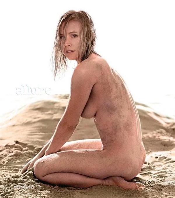 Kristen Bell nude photo enhanced from her 2014 photoshoot with Allure Magazine showing off her topless big tits and naked ass in the sand.