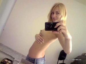 Anonymous taking a selfie and - breasts