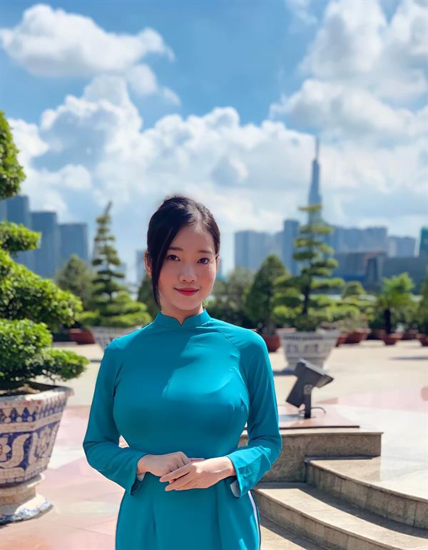 Busty Vietnamese receptionist in ao dai