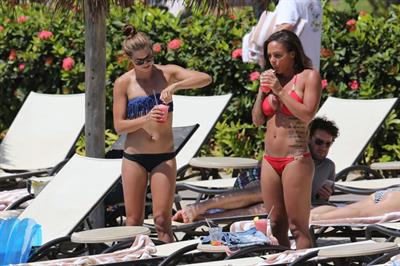 Alex Morgan and Sydney Leroux in bikinis on the beach in Hawaii