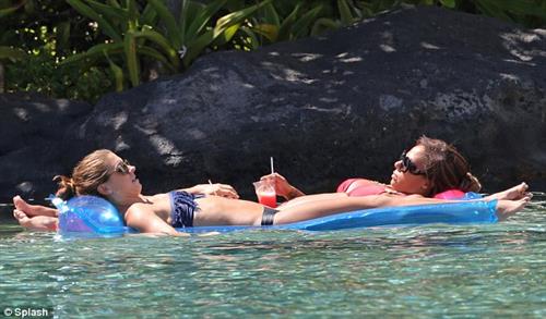 Alex Morgan and Sydney Leroux in bikinis on the beach in Hawaii