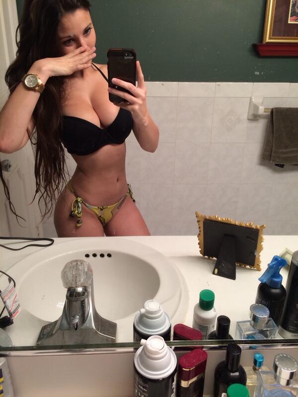 Angie Varona in a bikini taking a selfie