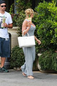 Pamela Anderson leaves barefoot a local Restaurant with a friend in Malibu July 6, 2013 